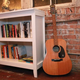 Illustration for article titled Tense Party Enters Third Hour Of Unplayed Acoustic Guitar Leaning Against Wall